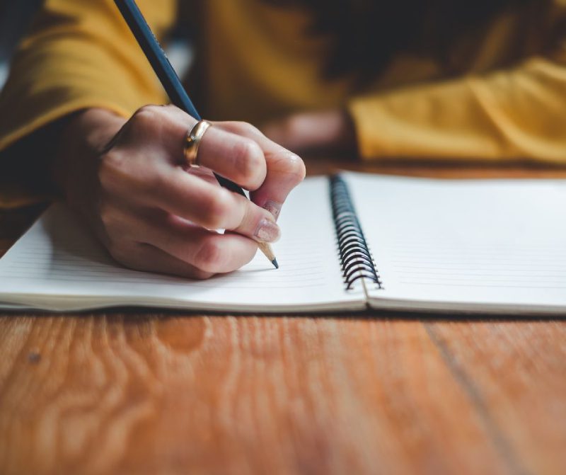 Girl writting in the note book